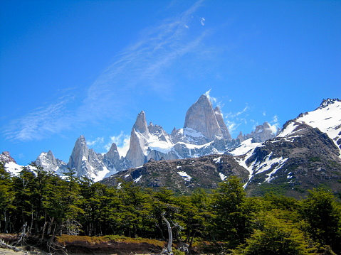 Wild nature with green forest surrounding Fitz Roy peak and Cerro Torre mountain, Patagonia