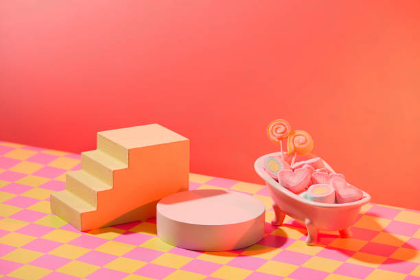Valentines day holiday background with empty podiums decorated with mini ceramic bathtub full with sweet marshmallow and candy. Blank space for displayed product