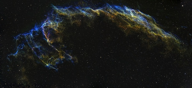 Deep space real astrophotography image of Vail Nebula NGC 6992. The Veil Nebula is a cloud of heated and ionized gas and dust in the constellation Cygnus.