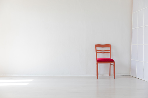 red old vintage chair in white room interior