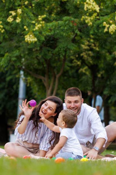 istock Young parents having fun with their little son whille on a picnic 1936894361
