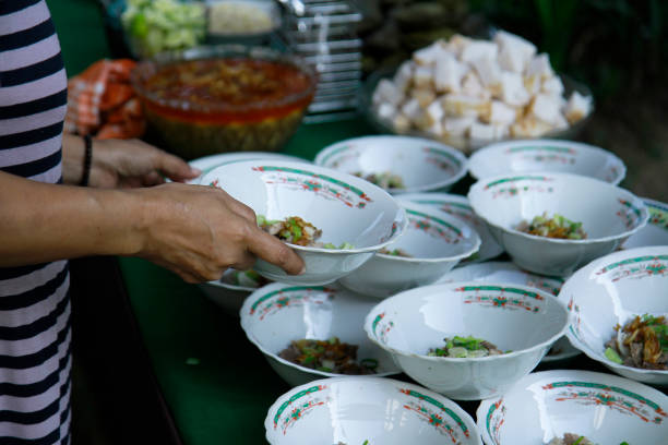 istock hand holding bowl, serving food 1936926143