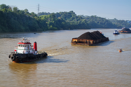 coal transported by the barges on Mahakam river, Samarinda, East Kalimantan, Indonesia