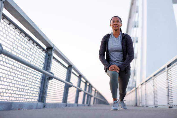 istock Woman stretching out before morning workout 1936966970