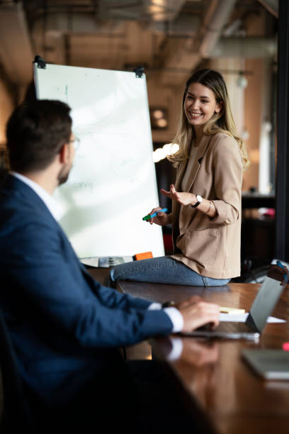 istock Young beautiful woman presenting businessplan. 1936974421