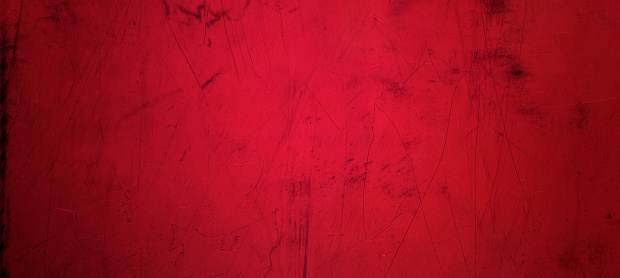 Grunge metal texture steel plate through the red filter. Can be used as background.
