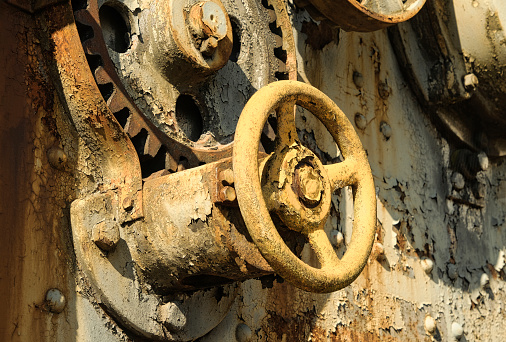 The ravages of time gnaw at everything, including these adjusting wheels on an old crane.