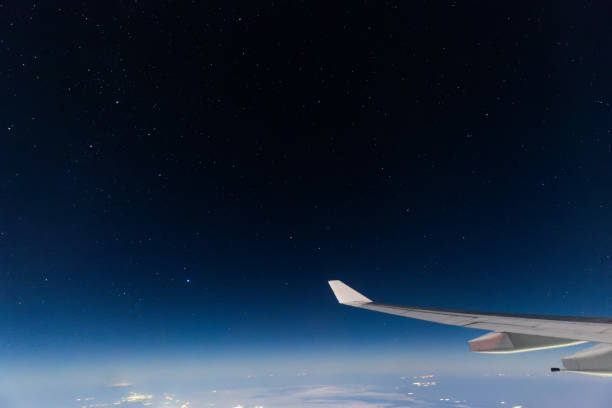 istock Views outside of airplane at night 1936996284