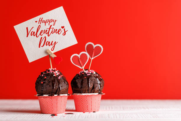 istock Cupcake love: Heart-themed treats on a vibrant red backdrop 1937018676
