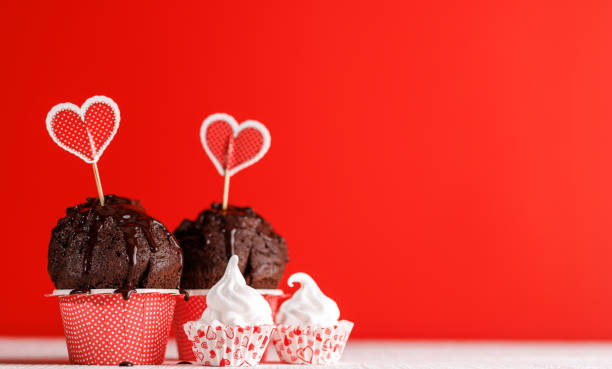 istock Cupcake love: Heart-themed treats on a vibrant red backdrop 1937019218