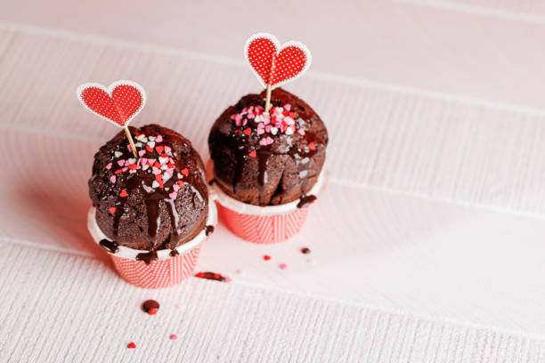 istock Cupcake love: Heart-themed treats on a vibrant red backdrop 1937020272