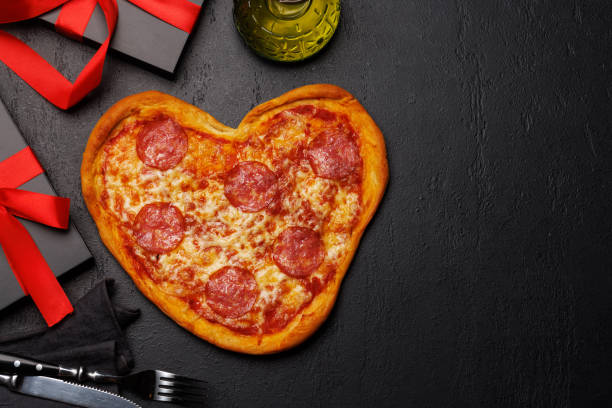 istock Heart-shaped pizza: Delicious love-themed dish 1937040313