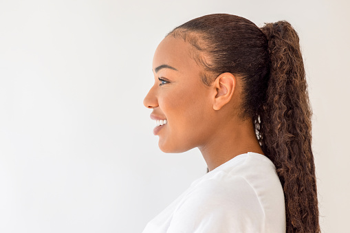 Beautiful smiling latin girl profile portrait