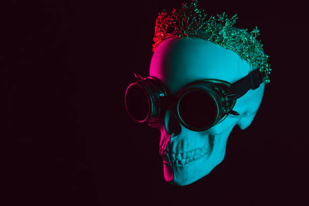 istock human skull in steampunk glasses and a crown with pink and blue light 1937047026