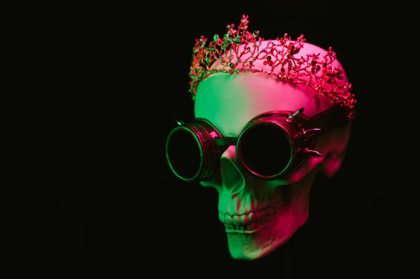 istock human skull in a crown and steampunk glasses with colored pink green neon light 1937047065