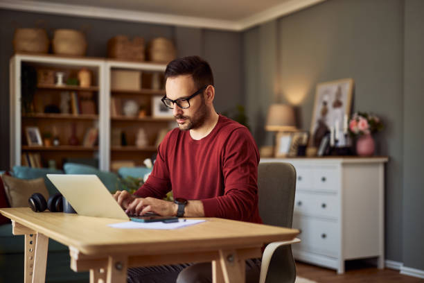 istock A focused male writer typing on his laptop while working from home. 1937048821
