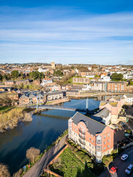 Exeter Quay and Cricklepit Bridge Exeter Quay and Cricklepit Bridge with cathedral in distance exeter england stock pictures, royalty-free photos & images