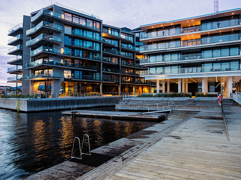 Modern city architecture, new quarter in Oslo - the residential complex of apartment buildings and outdoor facilities in Aker Brygge. Scandinavian residential area