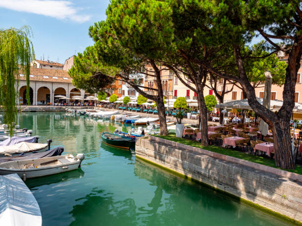 Holidays in Italy - old harbour Porto Vecchio in Desenzano del Garda, early morning.
