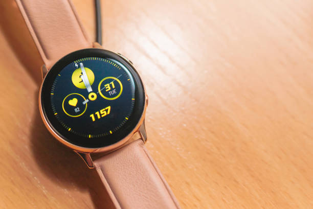 istock Smartwatch charging.Smart watch on wireless charging with on-screen charging indicator.Top view. Place for text.copy space. 1937091465