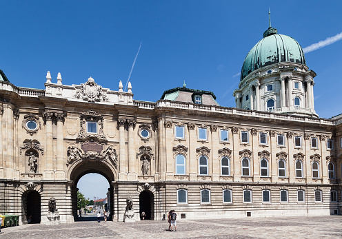 The entrance gate of the beautiful palace with its large dome on the Buda hill, Buda Castle. \nBudapest, Hungary