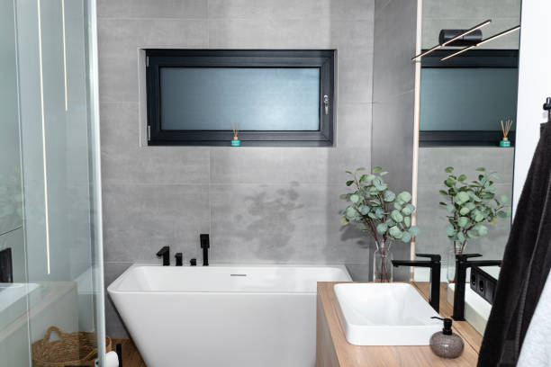 istock LED light strips mounted in the wall in a modern bathroom, visible bathtub. 1937094367