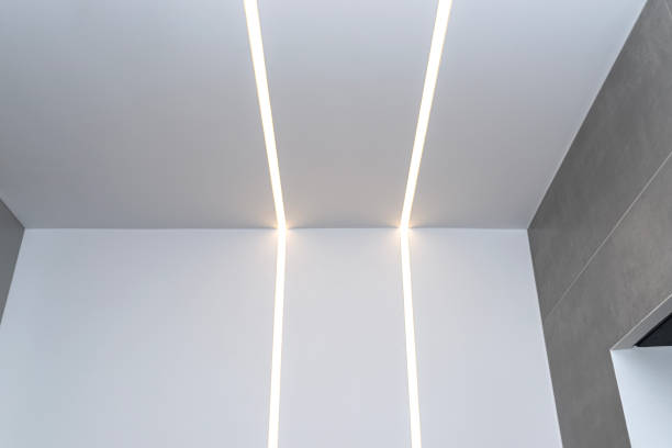 istock LED light strips mounted in the wall and ceiling in a modern bathroom. 1937097073