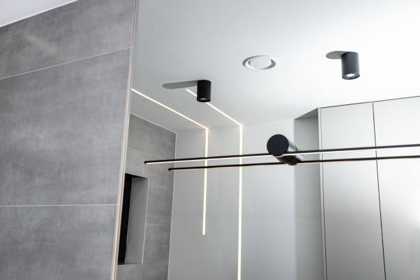 istock LED light strips mounted in the wall and ceiling in a modern bathroom, visible ventilation anemostat. 1937097075