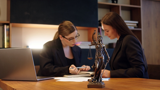 Cropped shot of a group of businesspeople standing in the office