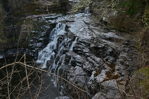 A view of the waterfalls on the river Clyde near New Lanark during winter in Scotland.