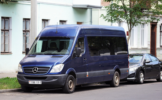 Belarus, Minsk-09.08.2023:A blue Mercedes-Benz Sprinter passenger minibus parked in the city.