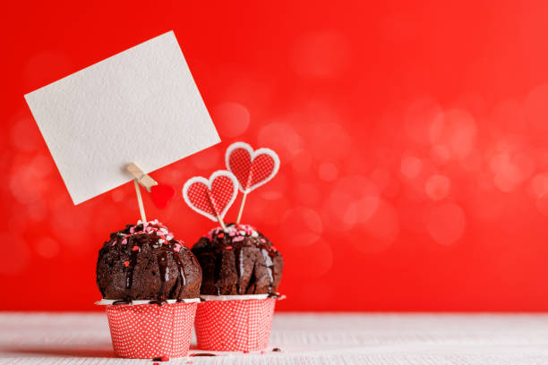 istock Cupcake love: Heart-themed treats on a vibrant red backdrop 1937115813