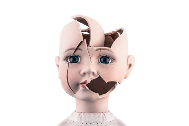 Broken vintage doll head isolated on white background with clipping path