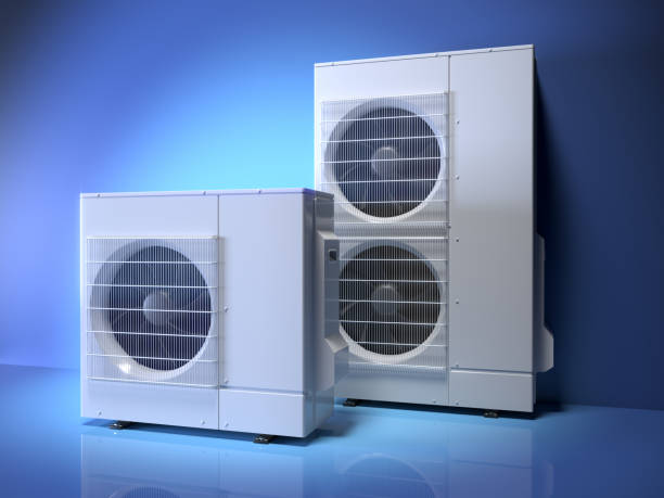 istock Two air heat pumps, blue background 1937123974