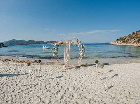 Beautiful wedding decorations on the beach by the sea.