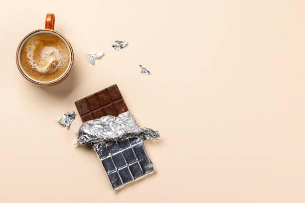 istock Coffee break bliss: Chocolate bar paired with a cup of coffee 1937127786