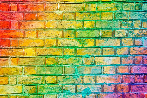 istock Colorful old brick wall background with rainbow effect 1937142557