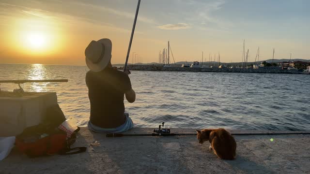 Man fishing in sunset