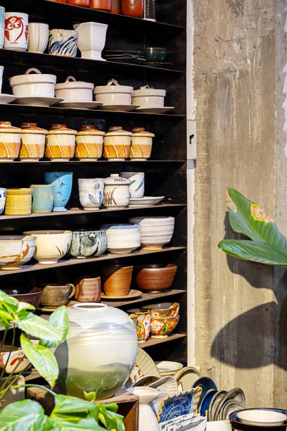 istock Multitude of handmade pottery shelves in small store. 1937166765