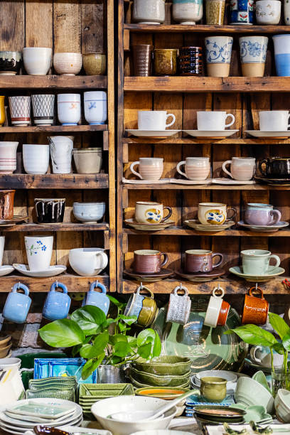 istock Multitude of handmade pottery shelves in small store. 1937166766