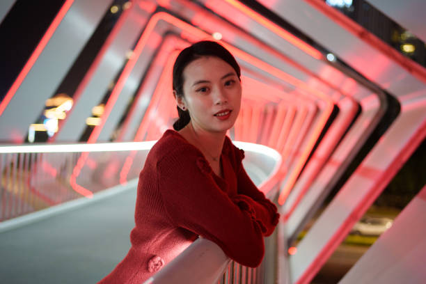 istock young woman leaning on railing 1937182442