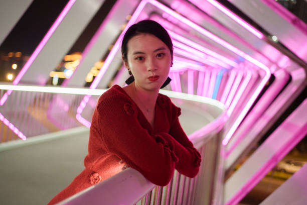 istock young woman leaning on railing 1937182443