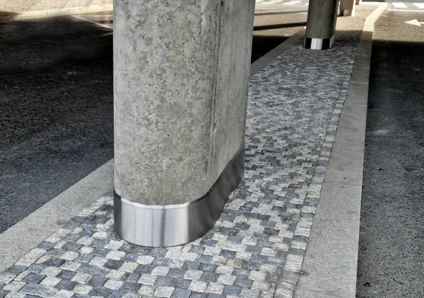 istock raised island between concrete columns. the bottom part of the concrete is lined with a shiny stainless steel sheet as additional protection, smooth 1937195527