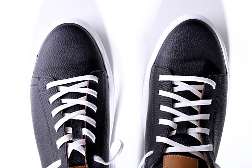 black sneakers mock up white background. High quality photo