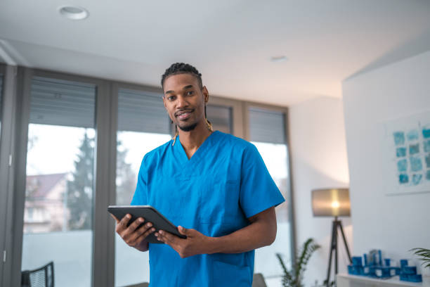 istock Black Male Nurse With Tablet Indoors 1937212909
