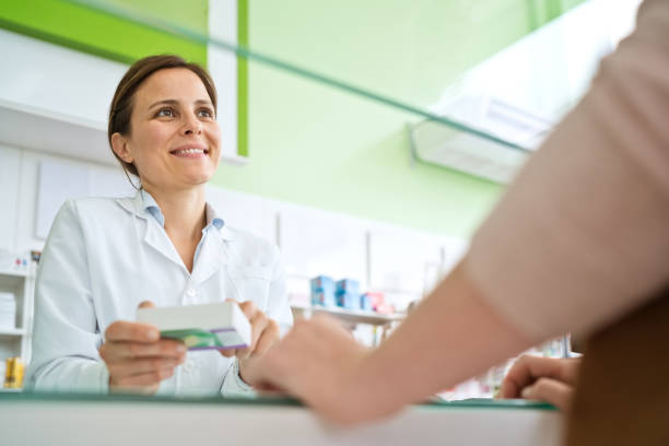 istock Female pharmacist holding medicine box 1937214537