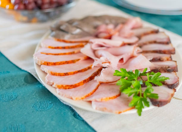 cold cut meat on a plate stock photo