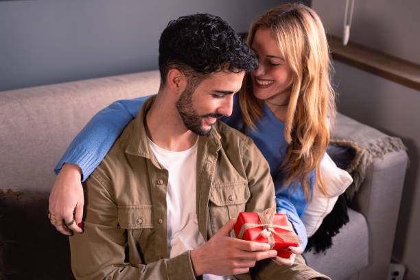 istock Valentine's Day celebration, gift giving and romantic couple concept. 1937242354