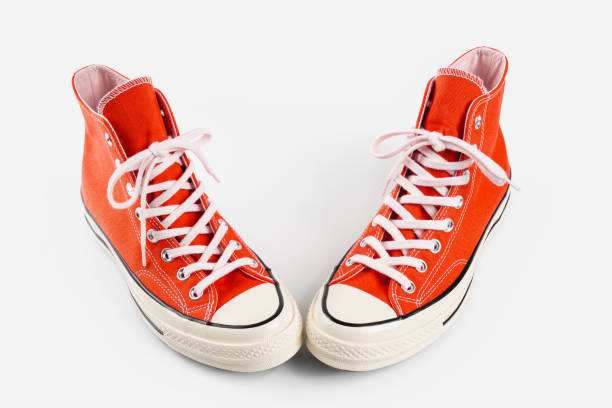 istock Red sneakers on white background with copy space. Youth shoes. 1937253227