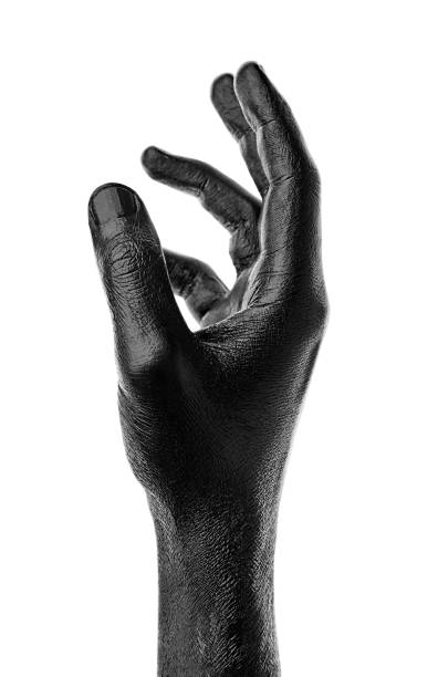 Black hand on white background, isolated, paint. Male hand isolated on black background. Hand showing symbols and gestures.